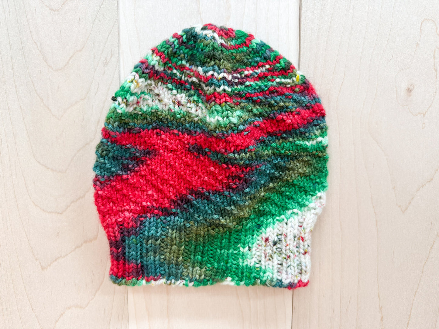 Handmade Festive Red, Green, and White Spiral Beanie Using 100% Superwash Merino Wool