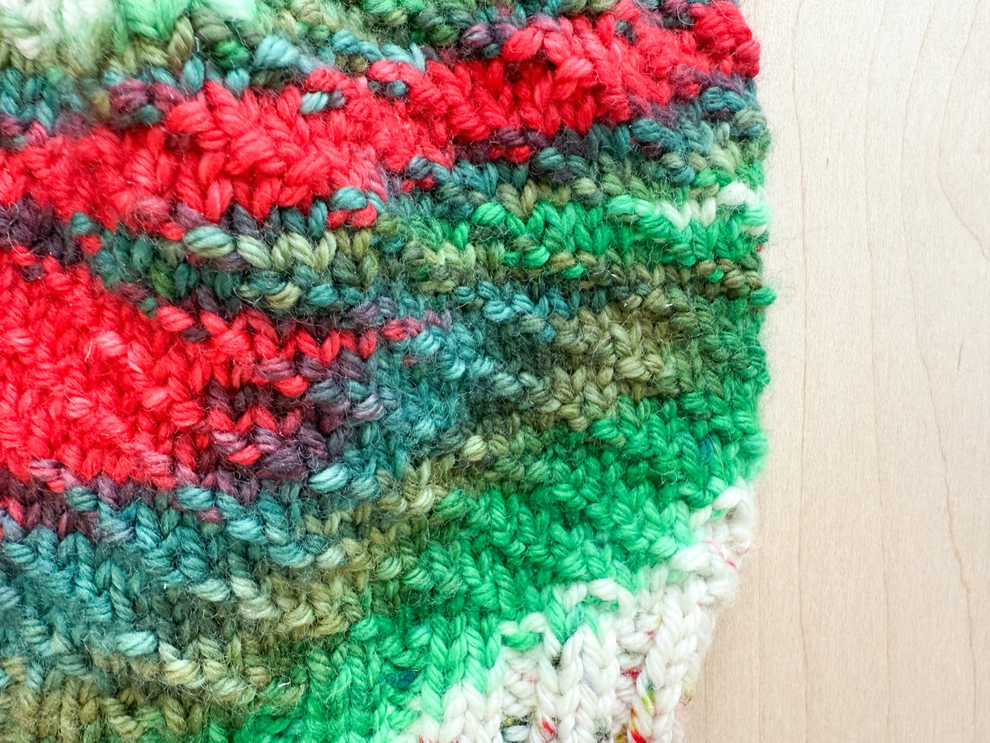 Handmade Festive Red, Green, and White Spiral Beanie Using 100% Superwash Merino Wool