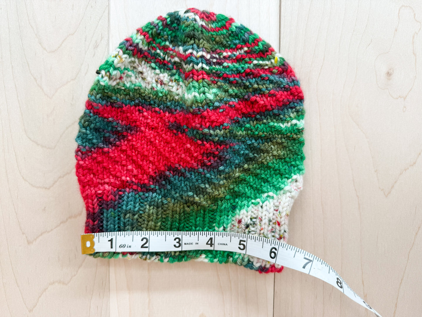 Handmade Festive Red, Green, and White Spiral Beanie Using 100% Superwash Merino Wool