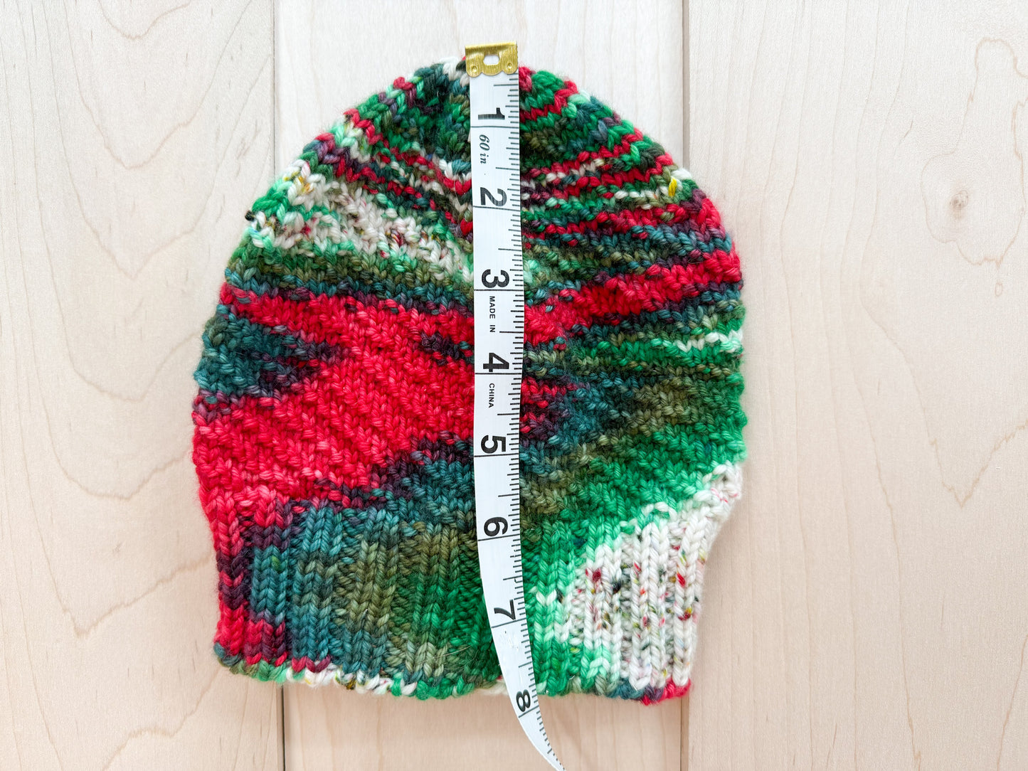 Handmade Festive Red, Green, and White Spiral Beanie Using 100% Superwash Merino Wool